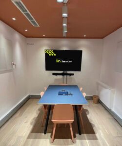 Meeting Room with TV screen showing iwGROUP logo