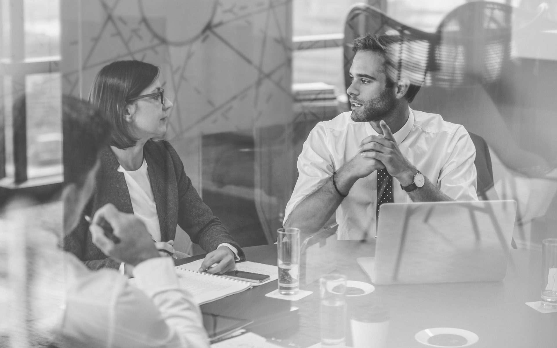 Two people in a meeting in an office workplace