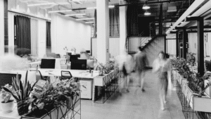 modern office space interior with blurred business colleagues walking