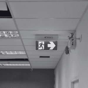 Emergency lighting sign showing the way to escape